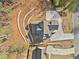 Overhead view of a new construction home on a landscaped lot with retaining walls and circular driveway at 52 Lake Overlook Dr, White, GA 30184
