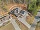 Bird's eye view of a new construction home on a hillside with a long driveway at 52 Lake Overlook Dr, White, GA 30184