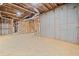 Unfinished basement with exposed beams and concrete walls ready for customization and expansion at 52 Lake Overlook Dr, White, GA 30184