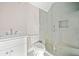Bright bathroom featuring a glass shower, a toilet, and a white vanity at 52 Lake Overlook Dr, White, GA 30184