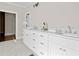 Bathroom has a long dual sink vanity and a doorway leading to another room at 52 Lake Overlook Dr, White, GA 30184