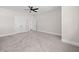 Neutral bedroom featuring light gray walls, carpet, ceiling fan, and closet at 52 Lake Overlook Dr, White, GA 30184