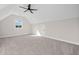 Spacious bedroom with gray carpet, ceiling fan, and a window at 52 Lake Overlook Dr, White, GA 30184
