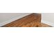 Beautiful hardwood flooring with white trim and baseboards at 52 Lake Overlook Dr, White, GA 30184