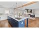 Open-concept kitchen with island, stainless steel appliances, and adjacent living area at 52 Lake Overlook Dr, White, GA 30184