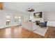 Bright living room with a fireplace and large windows at 52 Lake Overlook Dr, White, GA 30184