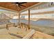 Covered patio overlooking tiered retaining walls at 52 Lake Overlook Dr, White, GA 30184