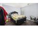 Modest bedroom with dark wood floors and furniture at 6540 Muirfield Pt, Fairburn, GA 30213