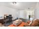 Cozy living room space with a comfortable seating area and a view of the upstairs hallway at 6540 Muirfield Pt, Fairburn, GA 30213