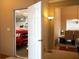 Bright foyer leading to a garage with a red truck and dining room beyond at 681 Nine Oaks Cir, Villa Rica, GA 30180