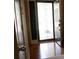 Front Door opens to a beautiful foyer with gleaming hardwood floors and an elegant glass-paneled door at 681 Nine Oaks Cir, Villa Rica, GA 30180