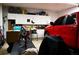 Spacious garage with organized storage cabinets and a red truck parked inside at 681 Nine Oaks Cir, Villa Rica, GA 30180