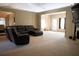 Spacious living room offers plenty of room for entertaining and relaxing, featuring neutral carpet at 681 Nine Oaks Cir, Villa Rica, GA 30180