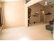 Neutral living room with a fireplace, TV, modern ceiling fan, and a comfortable chair at 681 Nine Oaks Cir, Villa Rica, GA 30180