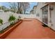 Outdoor patio area with white fencing and planting beds for a touch of nature at 102 Manley Ct, Woodstock, GA 30188
