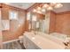 Bathroom boasts stylish wallpaper, large mirror, tub, and ample counter space at 102 Manley Ct, Woodstock, GA 30188