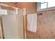 Bathroom featuring a glass shower enclosure, towel rack, and neutral decor at 102 Manley Ct, Woodstock, GA 30188