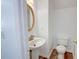 Cozy half bathroom featuring a pedestal sink, toilet, and wood-look vinyl flooring at 102 Manley Ct, Woodstock, GA 30188