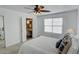 Comfortable bedroom with fan, a view into en-suite bathroom and ample natural light at 102 Manley Ct, Woodstock, GA 30188