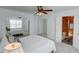 Spacious bedroom with closet and a view into en-suite bathroom and ample natural light at 102 Manley Ct, Woodstock, GA 30188