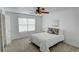 Bright bedroom featuring a ceiling fan, and a comfortable sleeping space at 102 Manley Ct, Woodstock, GA 30188