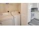Convenient laundry room with washer, dryer, and additional storage space at 102 Manley Ct, Woodstock, GA 30188
