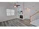 Bright living room with a fireplace, hardwood floors, and plenty of natural light at 102 Manley Ct, Woodstock, GA 30188