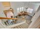 Open living room view from staircase with high ceilings and large windows at 102 Manley Ct, Woodstock, GA 30188