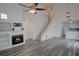 Bright, open-concept living room featuring high ceilings, fireplace, and hardwood floors at 102 Manley Ct, Woodstock, GA 30188