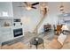 Spacious living room with fireplace, TV, stylish decor, dining area and staircase with beautiful wood spindles at 102 Manley Ct, Woodstock, GA 30188
