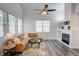 Bright and modern living room with vaulted ceiling, cozy seating, fireplace and TV for relaxing and entertaining at 102 Manley Ct, Woodstock, GA 30188