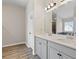Elegant bathroom with double vanity with stone countertops and modern fixtures at 1052 Bodega Loop, Locust Grove, GA 30248