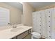 Bathroom featuring a stylish vanity and a shower with a modern curtain at 1052 Bodega Loop, Locust Grove, GA 30248