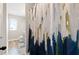 Bathroom featuring a shower with a colorful shower curtain and natural light at 1052 Bodega Loop, Locust Grove, GA 30248