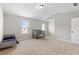 Spacious bedroom with two cribs bathed in natural light from two windows at 1052 Bodega Loop, Locust Grove, GA 30248