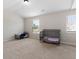Bright bedroom featuring two cribs bathed in natural light from the windows at 1052 Bodega Loop, Locust Grove, GA 30248