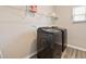 Laundry room featuring modern washer and dryer on stylish gray wood-look flooring at 1052 Bodega Loop, Locust Grove, GA 30248