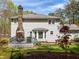 Rear exterior showcasing deck area, bay window, and brick chimney at 3227 Heritage Way, Buford, GA 30519
