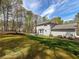 Large backyard and landscaping behind home at 3227 Heritage Way, Buford, GA 30519