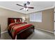 Bedroom with a ceiling fan, window, and carpet floors at 3227 Heritage Way, Buford, GA 30519