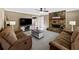 Spacious living room with a stone fireplace, large TV, and cozy seating at 3227 Heritage Way, Buford, GA 30519