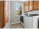 Functional laundry room with washer, dryer, and storage cabinets at 5660 Trout Creek Dr, Douglasville, GA 30135