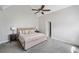 Bright and airy main bedroom with neutral color palette and vaulted ceiling at 5660 Trout Creek Dr, Douglasville, GA 30135