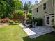 An inviting backyard features a stone patio, a lawn, and an outdoor seating area for relaxation at 710 Greystone Ne Park, Atlanta, GA 30306