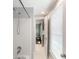 Bright bathroom features white tile, tub, shower and updated fixtures; a great space to unwind at 710 Greystone Ne Park, Atlanta, GA 30306