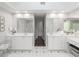 Spacious bathroom with dual vanities, a makeup vanity, soaking tub, and walk-in shower at 710 Greystone Ne Park, Atlanta, GA 30306