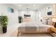 This bedroom features natural light, neutral colors, and stylish decor that creates a peaceful atmosphere at 710 Greystone Ne Park, Atlanta, GA 30306