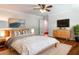 Comfortable bedroom featuring a large bed, ceiling fan, and modern decor for a serene atmosphere at 710 Greystone Ne Park, Atlanta, GA 30306