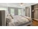 Serene bedroom with a plush bed, natural light, and a walk-in closet for ample storage space at 710 Greystone Ne Park, Atlanta, GA 30306