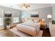 This bright and inviting bedroom offers a calming retreat with a ceiling fan, and natural light at 710 Greystone Ne Park, Atlanta, GA 30306